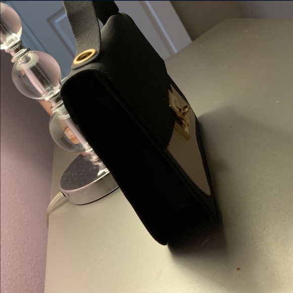 A small purse. Mostly for accessory. Black with some crème. - Picture 2 of 5